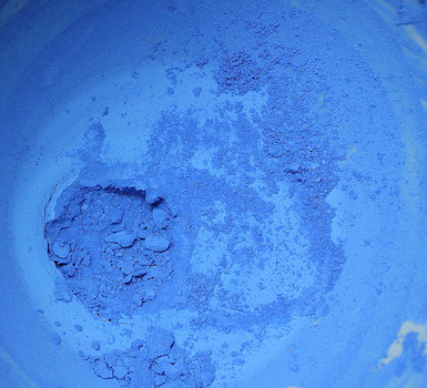 A closeup of bright blue ultramarine pigment