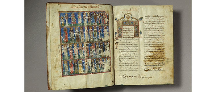 Conservation: Greek illuminated manuscript The frontispiece of a Greek illuminated manuscript - the left page shows a detailed painting. A blue background with fours rows depicting different groups of people. The right page is two columns of text with an ornate decoration at the top