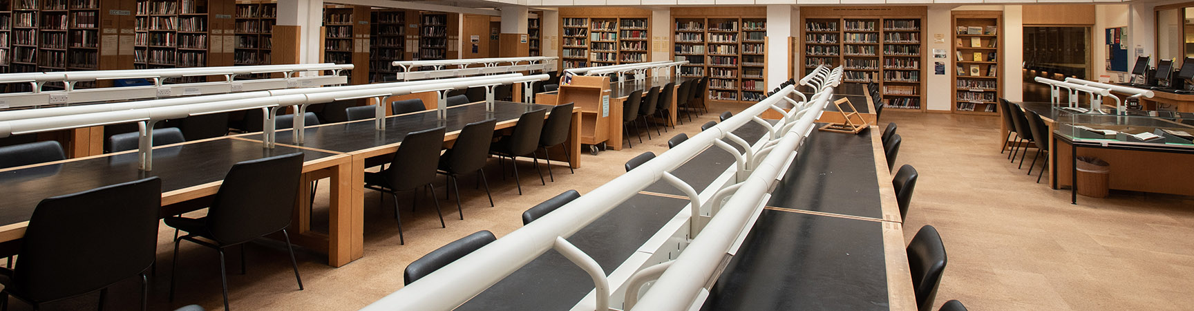 Long rows of black desks and chairs