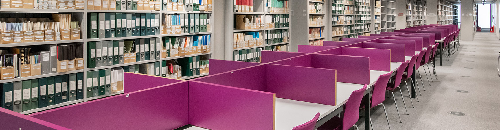 Rows of desks with purple separators between them