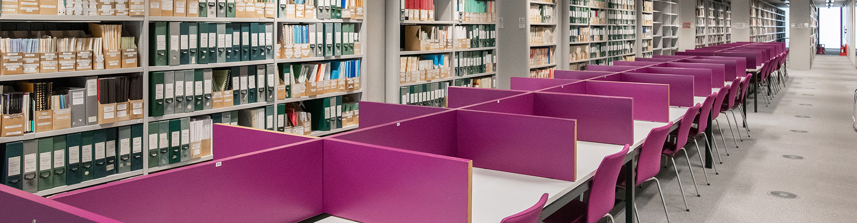Rows of desks with purple separators between them