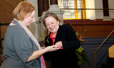 Two women look at the Bodley Medal