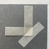 2.7 Style 2: Fixed mini mounting corners A piece of paper folded into a 'L' shape with another piece of paper covering it diagonally
