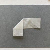 A piece of paper folded downward at the middle