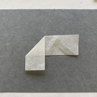 3.2 Style 3: Loose mounting corners, "Frog legs" A piece of paper folded downward at the middle