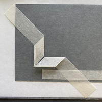 A piece of paper folded at two right angles in the middle