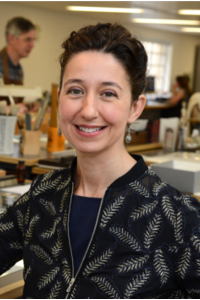 Virginia M. Lladó-Buisán A portrait photograph of a woman with short brown hair looking directly at the camera
